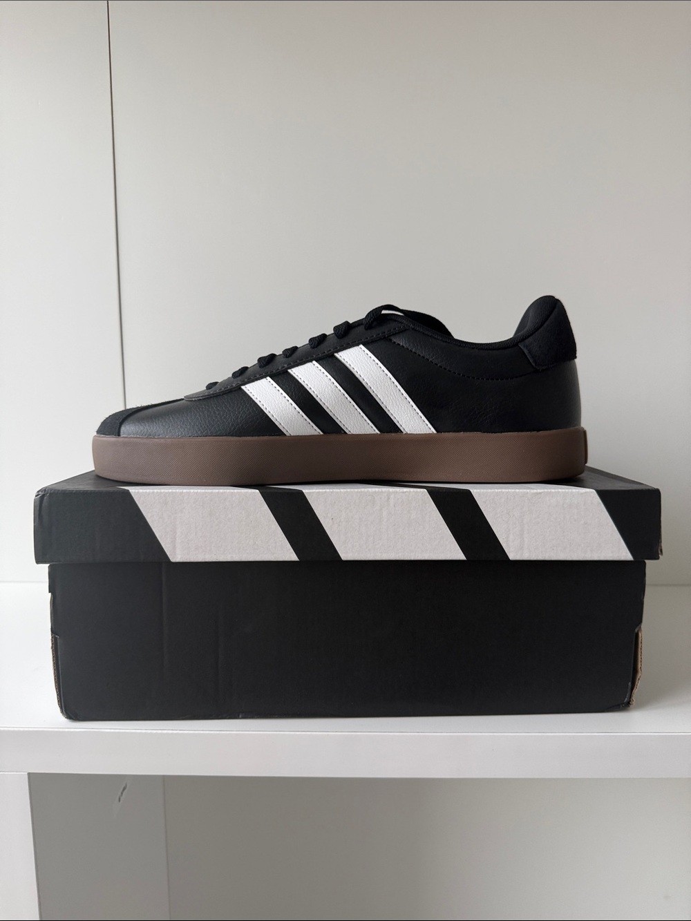 Adidas Black Low-Top Sneakers with White Stripes and Brown Sole